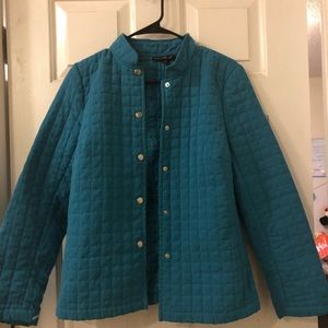 A turquoise button up fall or winter coat.